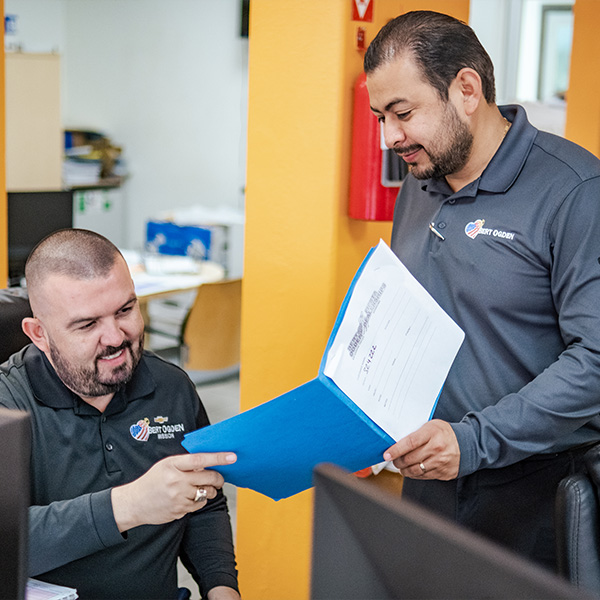 Service technicians looking at paperwork
