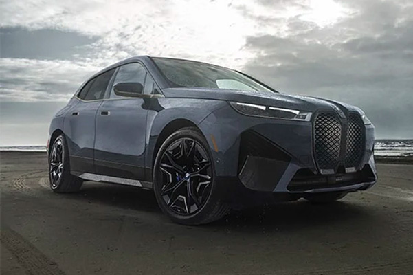 2022 BMW iX driving on beach