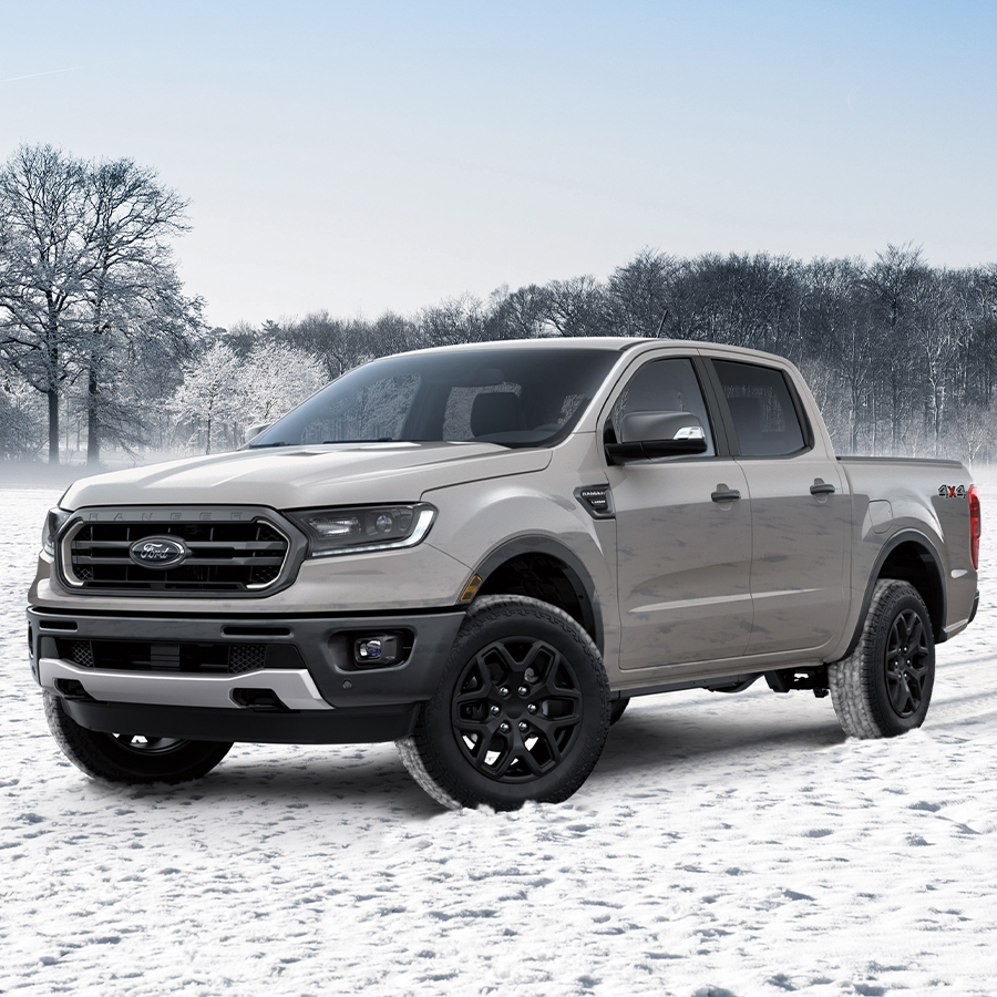 Ford truck driving in snow