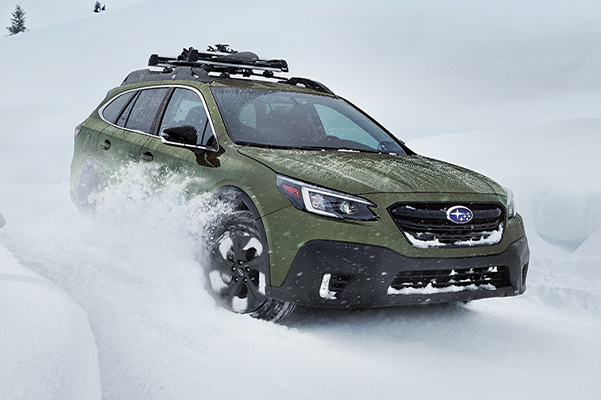 Subaru driving in snow