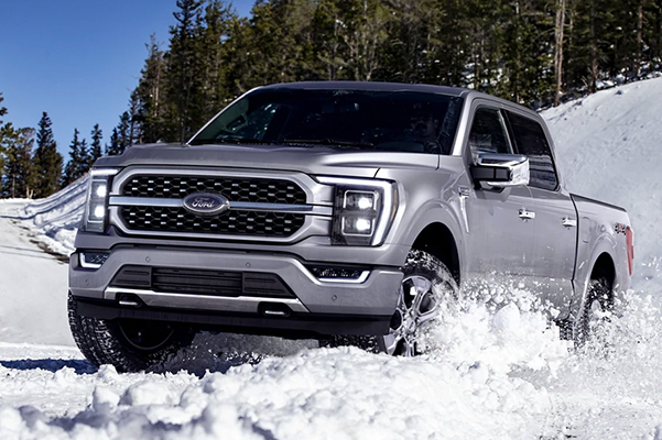 Ford F-150 being driven through snow