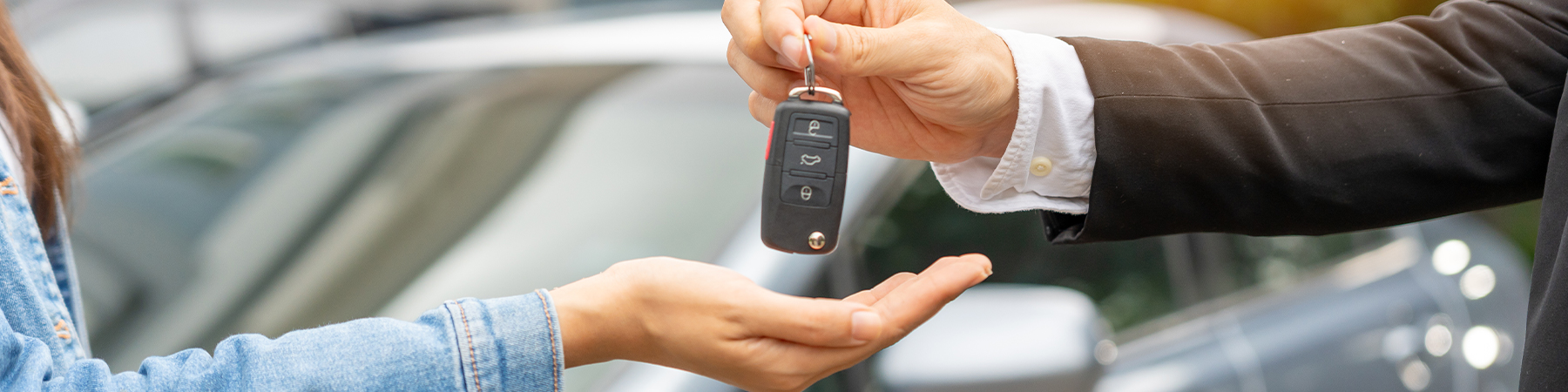 Dealership manager send car keys to the new owner.