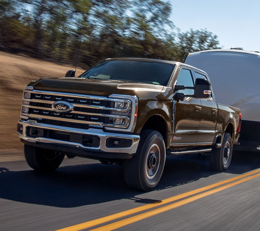 2024 Super Duty® Tremor® pickup pulling a camper trailer