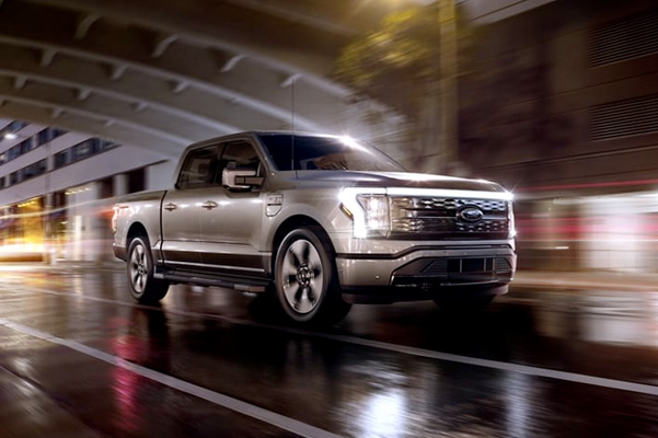 A 2022 Ford® F-150 Lightning driving through a tunnel in an urban environment