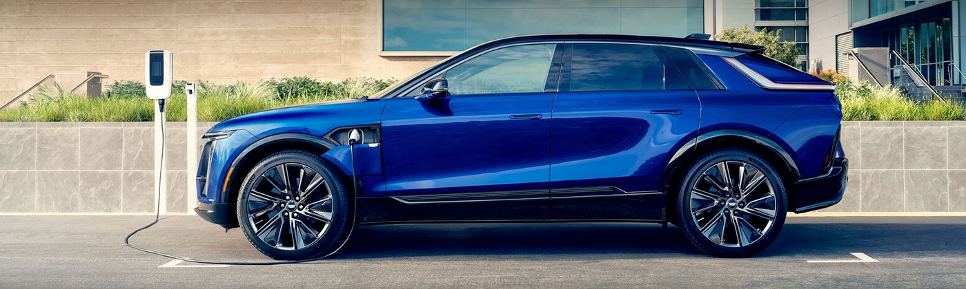 2024 Cadillac LYRIQ charging outside building