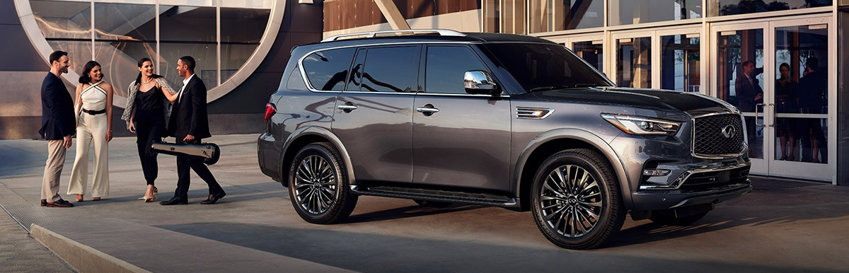 INFINITI QX80 parked outside office building