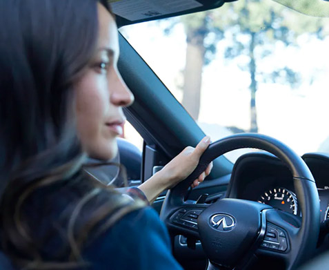 Woman driving an INFINITI