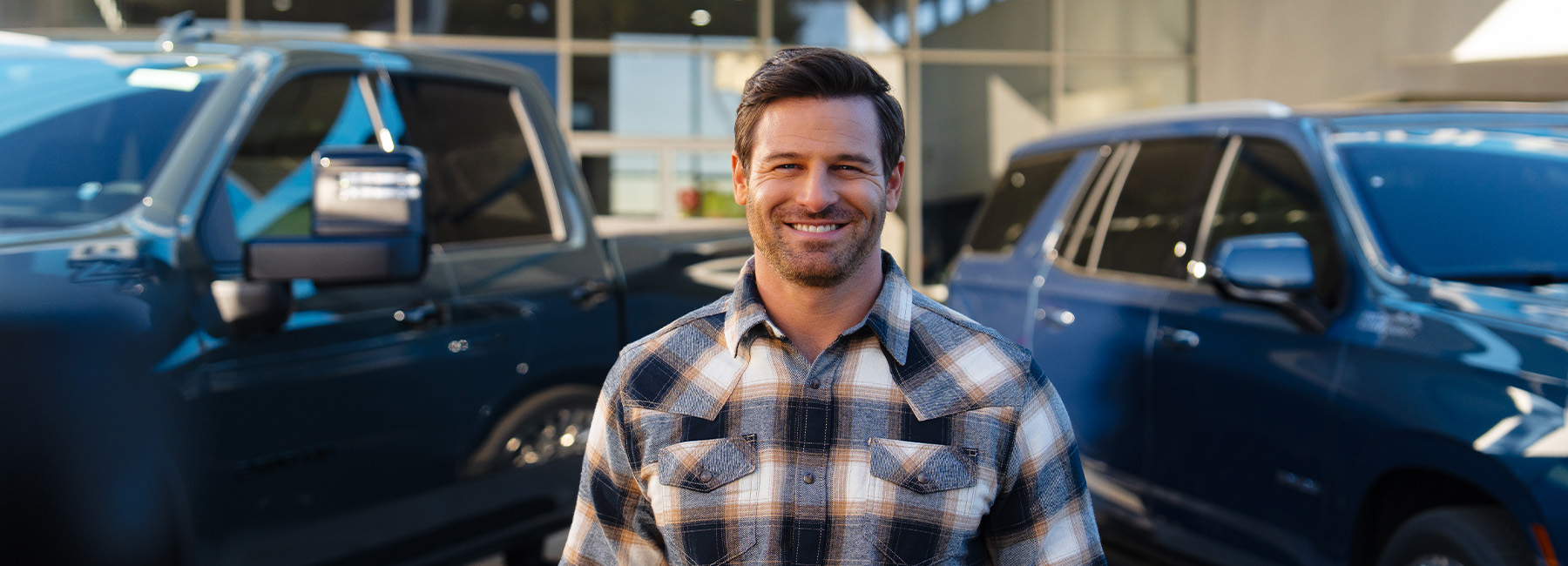Man standing in front of dealership