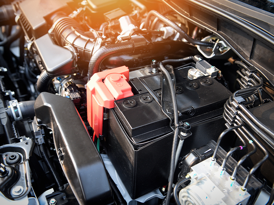 Service tech testing a battery