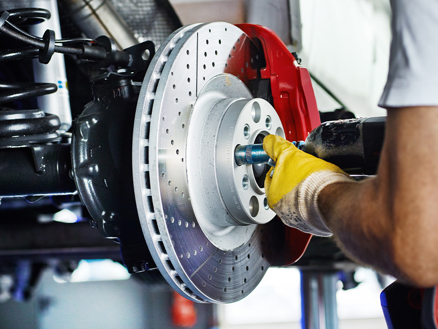 Close up of hands holding brake pads