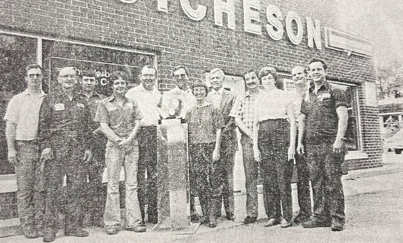 Vintage Photo of Dealership employees outside the dealership