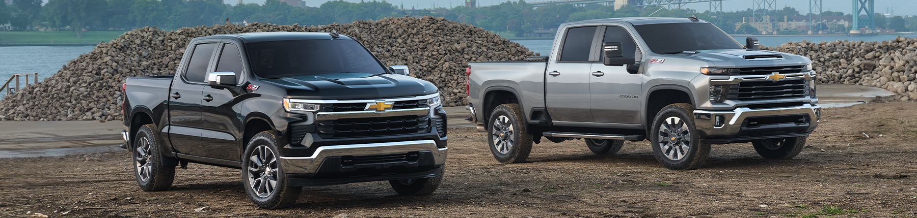 Left to Right: Silverado 1500 Crew Cab LT Short Bed with Z71 in Black; Silverado 2500 HD Custom Standard Bed with Z71 in Sterling Gray Metallic