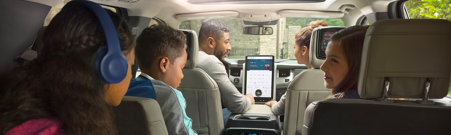 Interior shot of family in 2024 Ford Expedition for road trip