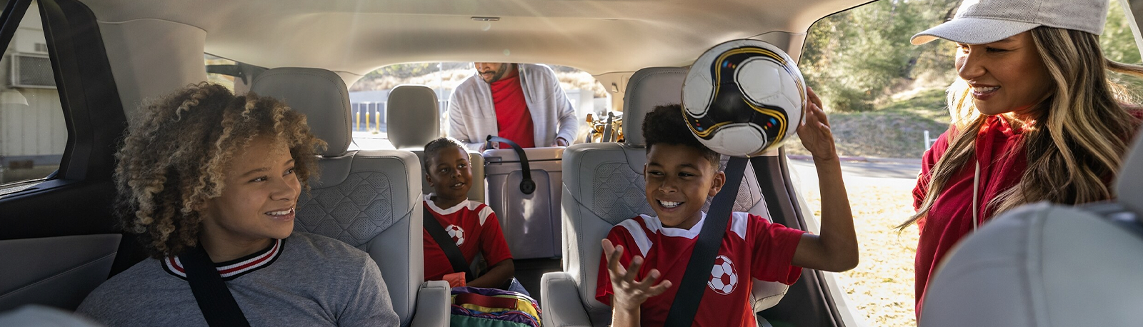 People in a 2025 Ford Explorer® interior with available Twin Panel Moonroof