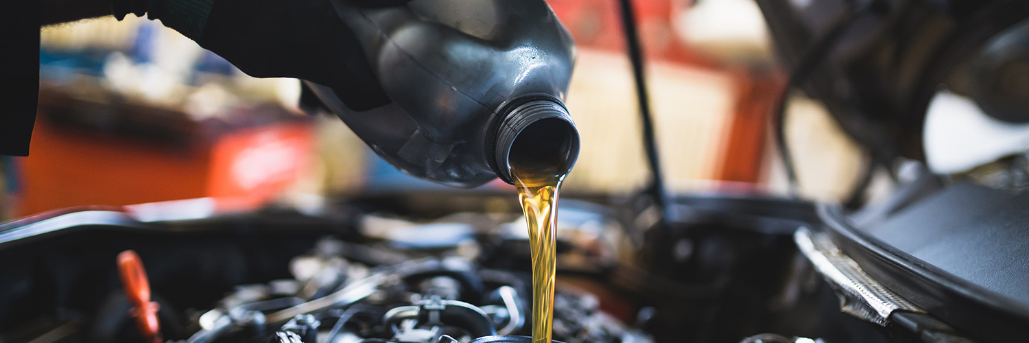 Car getting its oil replaced in service