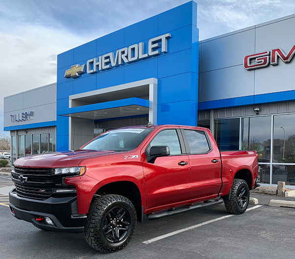 Outside of the dealership with Silverado