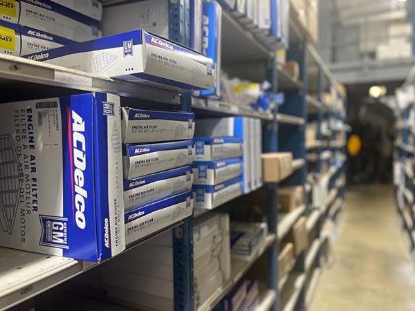 Service tech checking inventory for parts