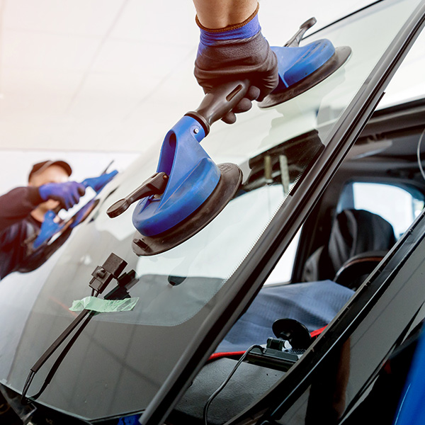 Windshield being replaced on vehicle