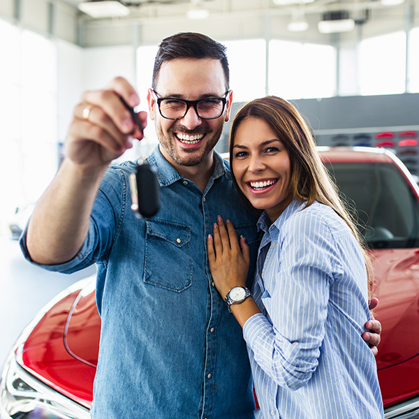 Customers smiling holding car keys