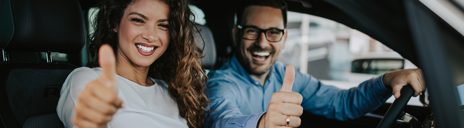 Happy couple buying new car