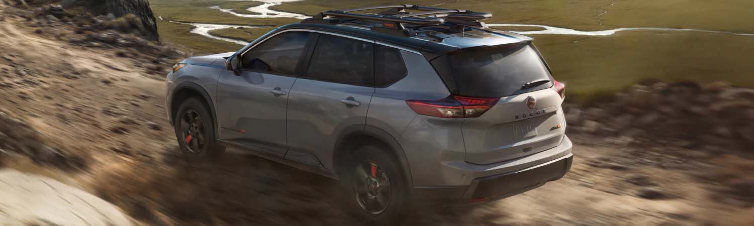 Nissan Rogue Rock Creek Edition driving fast on a dirt road